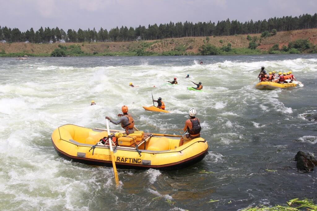 Rescue boats pick up swimmers after their rafts had flipped in the rapids of the Victoria Nile.