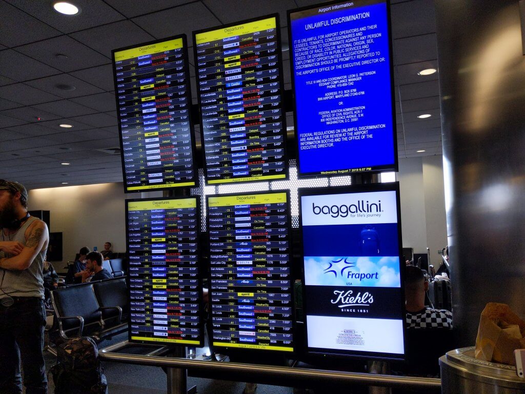 Departures board showing many delays and cancelations