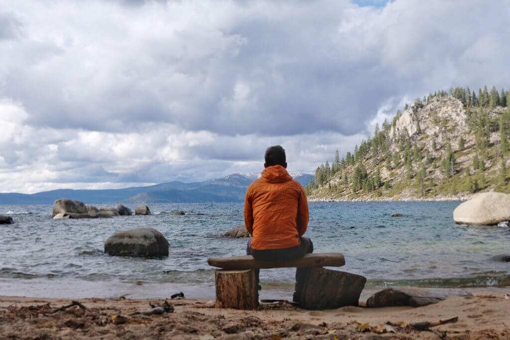Sitting on a bench on the beach of Lake Tahoe