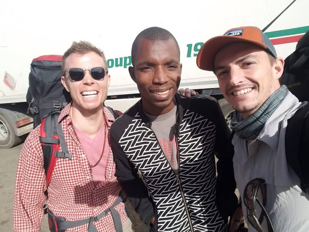 The Adventure Dudes posing with our local guide, Mamadou